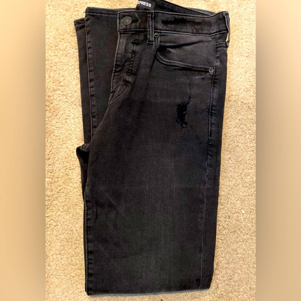 Mens express skinny lightly distressed black denim.